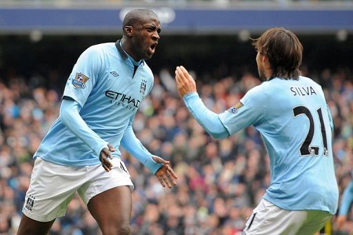 Manchester City&#039;s Yaya Toure (L) and David Silva are pictured during their match against Chelsea on February 24, 2013