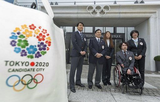 Members of the delegation of the Tokyo bid of the Japanese Olympic Committie pose in Lausanne on January 7, 2013