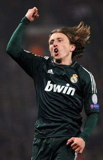 Real Madrid midfielder Luka Modric celebrates scoring the equaliser against Manchester United on March 5, 2013
