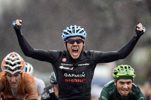 Team Garmin-Sharp&#039;s US cyclist Andrew Talansky celebrates as he crosses the finish line on March 6, 2013