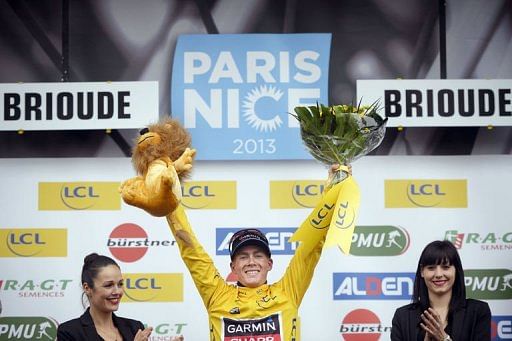 Team Garmin-Sharp&#039;s US cyclist Andrew Talansky celebrates with his overall leader yellow jersey on March 6, 2013