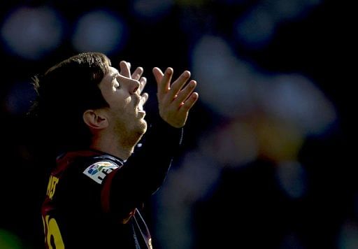 Barcelona&#039;s Lionel Messi reacts at the Santiago Bernabeu stadium in Madrid on March 2, 2013