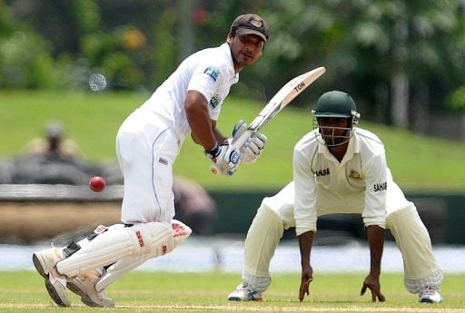Kumar Sangakkara (left) plays a shot during a Test match against Bangladesh in Galle on March 8, 2013