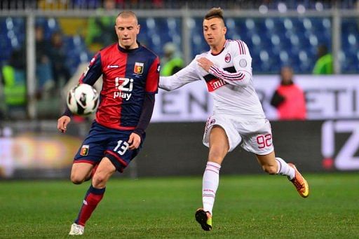 AC Milan's forward Stephan El Shaarawy (R) clashes with Genoa's defender Luca Antonelli on March 8, 2013