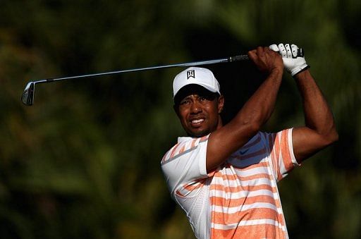Tiger Woods of the US tees off on the 13th hole on March 8, 2013 in Doral, Florida