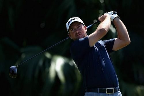 Graeme McDowell of Northern Ireland tees off on the 12th hole on March 8, 2013 in Doral, Florida