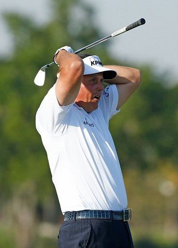 Phil Mickelson nearly holes out from the ninth tee on March 8, 2013 in Doral, Florida