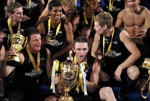 New Zealand players celebrate after defeating Argentina to win the Sultan Azlan Shah Cup, in 2012