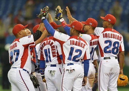 Cuban players celebrate their win over Taiwan in the World Baseball Classic tournament at Tokyo Dome on March 9, 2013