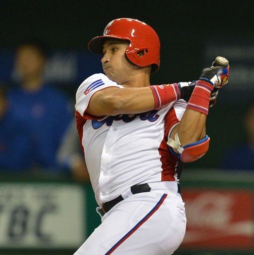 Cuba&#039;s outfielder Frederich Cepeda makes a two-base hit in the World Baseball Classic at Tokyo Dome on March 9, 2013