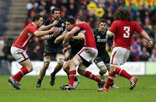 Scotland&#039;s Sean Maitland is tackled by Ian Evans in Edinburgh on March 9, 2013