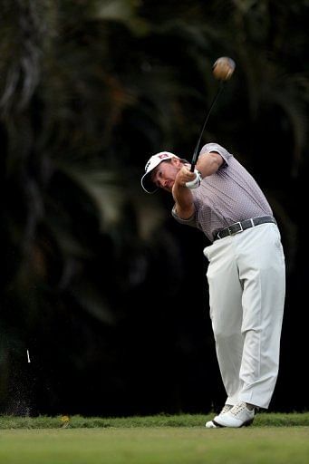 Graeme McDowell of Northern Ireland tees off on the 16th hole on March 9, 2013 in Doral, Florida