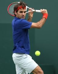 Roger Federer of Switzerland hits a return to Denis Istomin of Uzbekistan on March 9, 2013 in Indian Wells, California