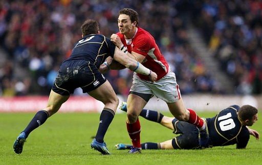 George North (R) is tackled by Sean Lamont during the Six Nations international at Murrayfield on March 9, 2013