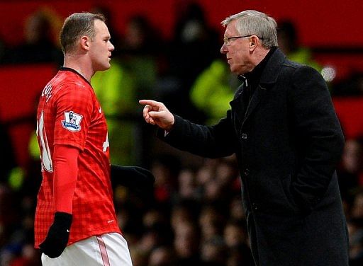 Alex Ferguson (R) gives instructions to Wayne Rooney during the clash with Southampton on January 30, 2013