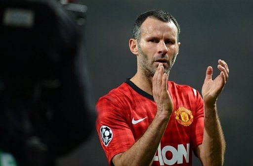 Manchester United midfielder Ryan Giggs applauds at the end of the defeat to Real Madrid on March 5, 2013
