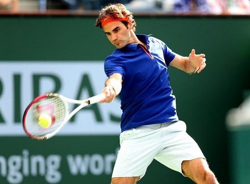 Roger Federer returns to Denis Istomin at Indian Wells on March 9, 2013