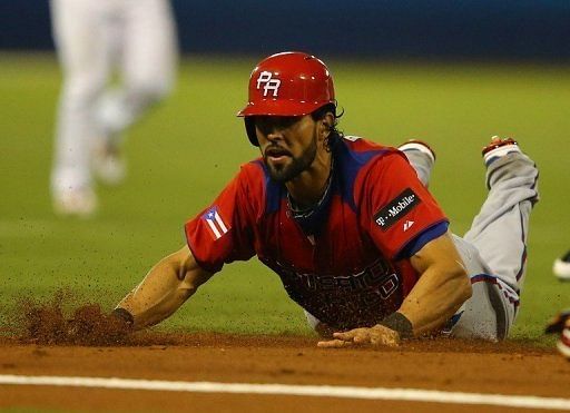 Angel Pagan of Puerto Rico is out after being tagged in a run down against Venezuela on March 9, 2013
