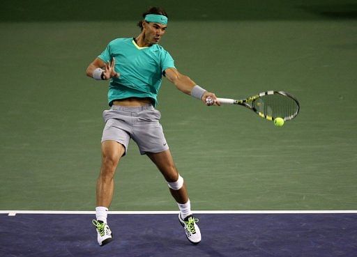 Rafael Nadal hits a return to Ryan Harrison at the BNP Paribas Open at Indian Wells on March 9, 2013