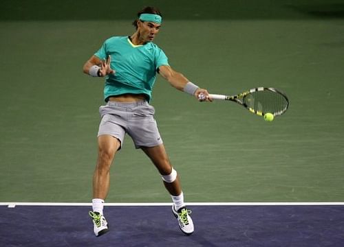 Rafael Nadal hits a return to Ryan Harrison at the BNP Paribas Open at Indian Wells on March 9, 2013
