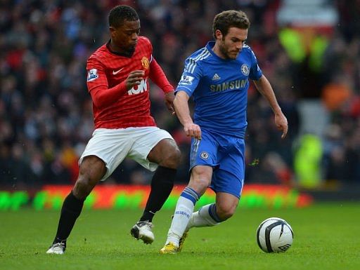 Manchester United&#039;s Patrice Evra (L) vies with Chelsea&#039;s Juan Mata at Old Trafford, on March 10, 2013