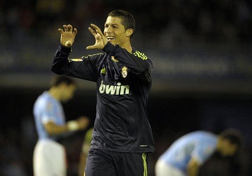 Real Madrid&#039;s Cristiano Ronaldo celebrates after scoring at the Balaidos Stadium in Vigo, on March 10, 2013