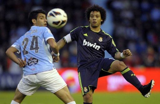 Celta&#039;s Augusto Fernandez (L) vies with Real Madrid&#039;s Marcelo in Vigo, on March 10, 2013