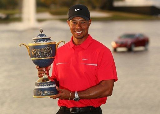 Tiger Woods poses with the Gene Sarazen Cup on March 10, 2013 in Doral
