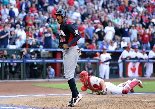 Adam Jones of the USA celebrates after scoring a run against Canada the World Baseball Classic on March 10, 2013