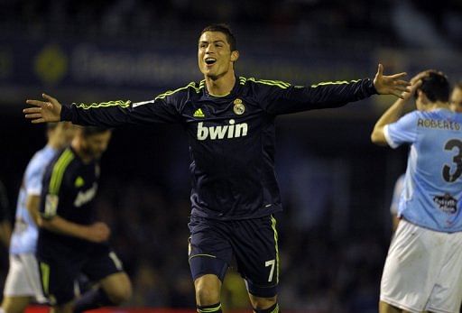 Real Madrid&#039;s Cristiano Ronaldo celebrates after scoring during their match against Celta Vigo on March 10, 2013
