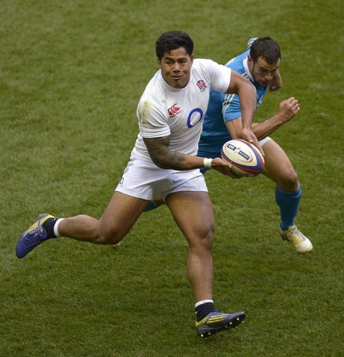 England centre Manu Tuilagi runs with the ball in front of Italy centre Gonzalo Canale at Twickenham on March 10, 2013