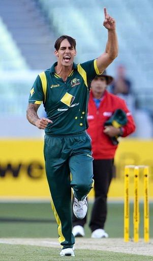Australian bowler Mitchell Johnson celebrates dismissing West Indies batsman Kieran Powell on February 10, 2013