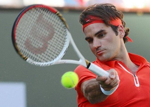 Roger Federer hits a forehand return against Ivan Dodig at Indian Wells on March 11, 2013