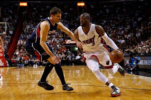 Dwyane Wade of the Miami Heat drives against Kyle Korver of the Atlanta Hawks on March 12, 2013