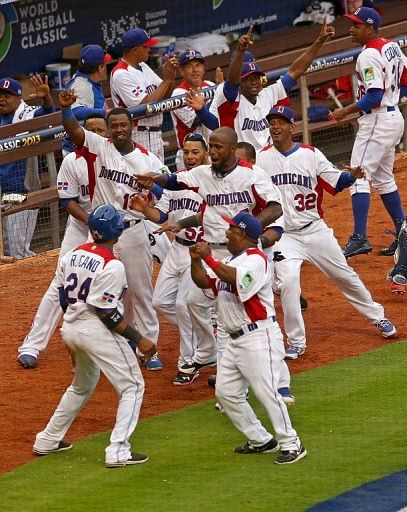 The Dominican Republic celebrate the winning run in the World Baseball Classic against Italy on March 12, 2013