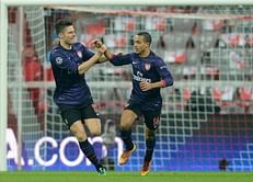 Gallant Gunners bow out despite win in Munich