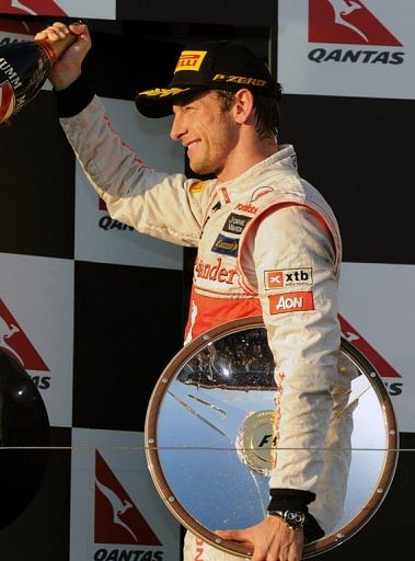 McLaren driver Jenson Button celebrates victory at the Australian Grand Prix in Melbourne on March 18, 2012