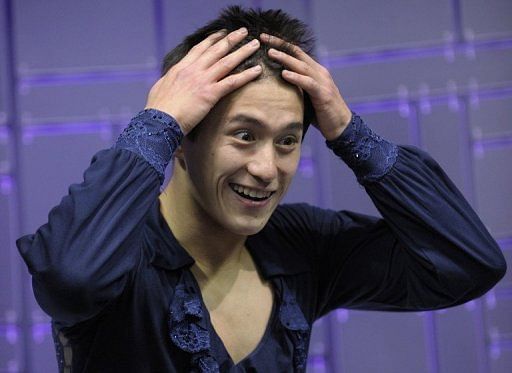 Patrick Chan reacts to his score of  98.37 at the World Figure Skating Championships on March 13, 2013