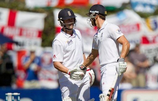 Nick Compton (R) earns a handshake from Jonathan Trott as the pair hit half centuries on March 14, 2013