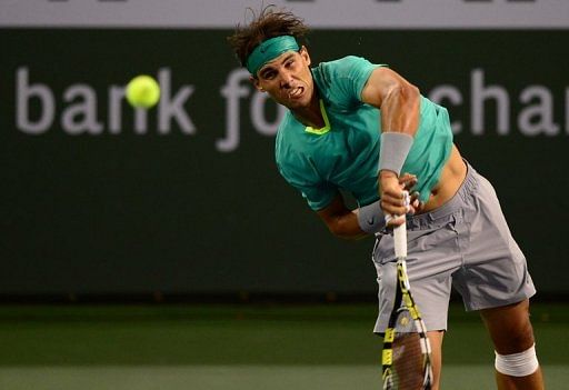 Rafael Nadal serves against Ernests Gulbis at the BNP Paribas Open in Indian Wells on March 13, 2013