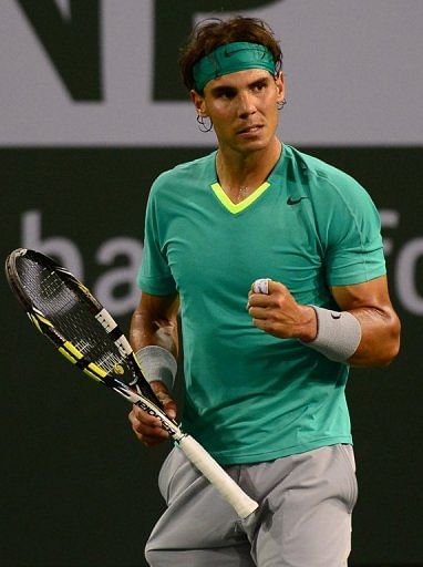 Rafael Nadal gestures after winning a point against Ernests Gulbis at the BNP Paribas Open on March 13, 2013