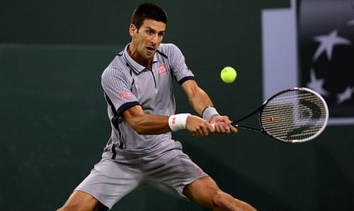 Novak Djokovic of Serbia hits a backhand return against Sam Querrey in Indian Wells, California on March 14, 2013