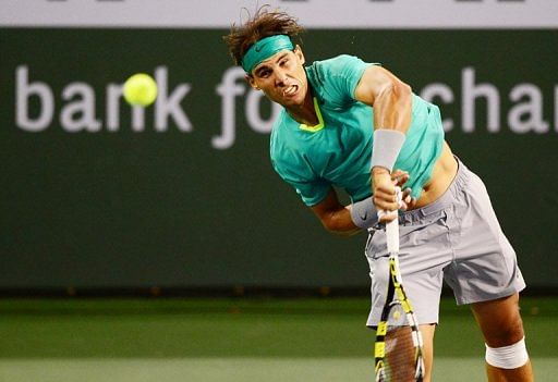 Rafael Nadal serves against Ernests Gulbis at the BNP Paribas Open in Indian Wells on March 13, 2013
