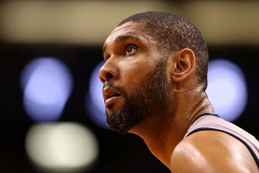 Tim Duncan, pictured last month, finished with 28 points and 19 rebounds as the Spurs clinched a playoff spot Thursday