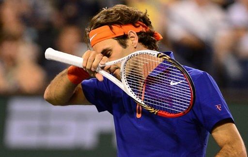 Roger Federer reacts after losing a point against Rafael Nadal on March 14, 2013 in Indian Wells