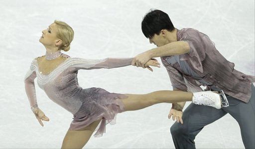 Tatiana Volosozhar and Maxim Trankov of Russia compete, March 15, 2013 in Canada