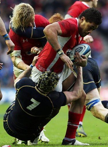 Wales&#039;s Toby Faletau (R) is tackled by Scotland&#039;s Kelly Brown (L), in Edinburgh, on March 9, 2013