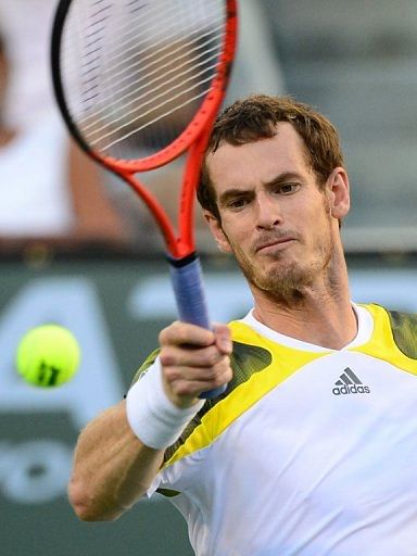 Andy Murray hits a forehand return to Juan Martin del Potro, in Indian Wells, California, on March 15, 2013