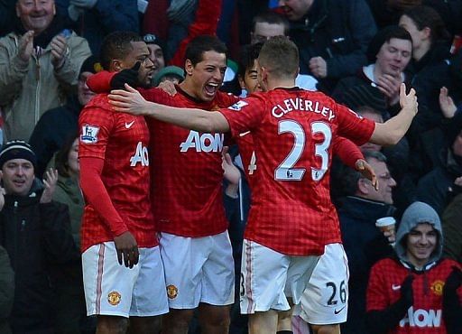 Manchester United players celebrate a goal during the match against Chelsea in Manchester, March 10, 2013