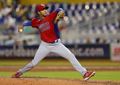 Nelson Figueroa of Puerto Rico pitches against the United States, in Miami, Florida, on March 15, 2013